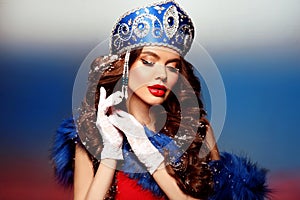 Russian beauty woman portrait. Fashion girl model with makeup and kokoshnik