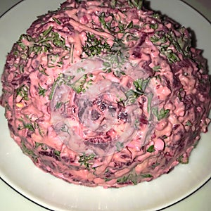 A russian beetroot salade with eggs, cheese and mayonnaise