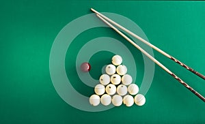 Russian billiard balls, cue, triangle, chalk on a table