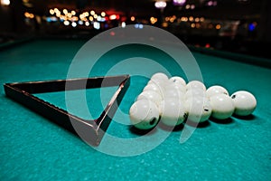 The russian billiards balls on the table with triangle