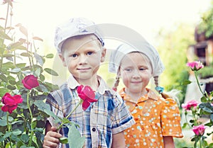 Russian boy and girl at roses