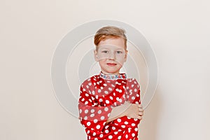 Russian boy in the red shirt on white background