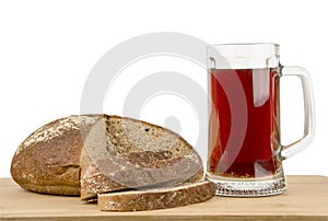 Russian brew in mug and loaf on white background