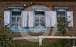 Russian Brown Log Cabin with Flowers