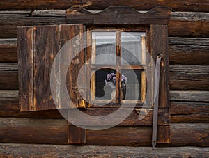 Russian Brown Log Cabin with Wooden Shutters