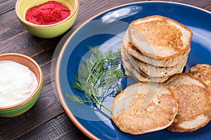 Russian buckwheat pancakes blini with cream and caviar