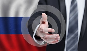Russian business, politics, cooperation and travel concept. Hand on flag of Russia background