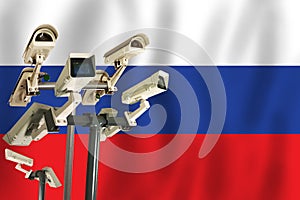 Russian CCTV camera on the flag of Russian. Surveillance, security, control and totalitarianism concept