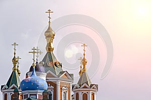 Russian Christian Orthodox church with domes and a cross against the sky. Russian Orthodoxy and Christian Faith concept.