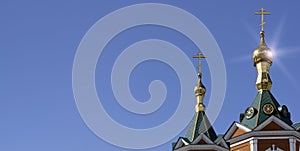 Russian Christian Orthodox church with domes and a cross against the sky. Russian Orthodoxy and Christian Faith concept.