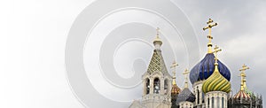 Russian Christian Orthodox church with domes and a cross against the sky. Russian Orthodoxy and Christian Faith concept.