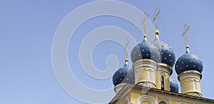 Russian Christian Orthodox church with domes and a cross against the sky. Russian Orthodoxy and Christian Faith concept.