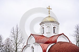 Russian Christian Orthodox church with domes and a cross against the sky. Russian Orthodoxy and Christian Faith concept