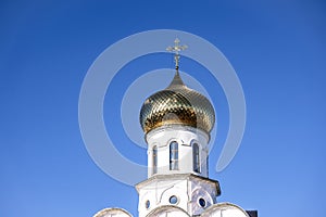 Russian Christian Orthodox church with domes and a cross against the sky. Russian Orthodoxy and Christian Faith concept