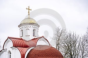Russian Christian Orthodox church with domes and a cross against the sky. Russian Orthodoxy and Christian Faith concept