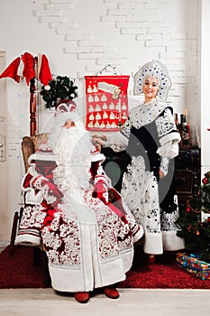 Russian Christmas characters: Ded Moroz, Santa and Snegurochka, snow girl posing in the studio