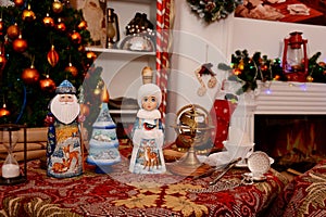 Russian Christmas figurine on the table in decorated room