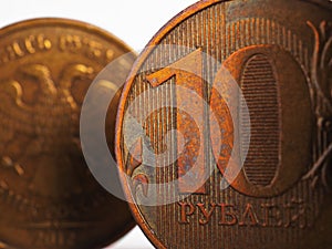 Russian coin 10 rubles, closeup fragment. Ruble tens on both sides. Economy, central bank and money of Russia. Bank and credit.