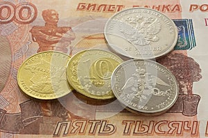 Russian coins on the five thousandth bill