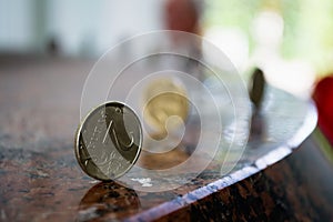 Russian coins standing on the granite table