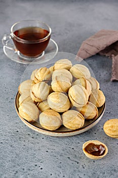 Russian cookies Nuts or Oreshki in shape of a walnut with boiled condensed milk. Russian cuisine, desserts.