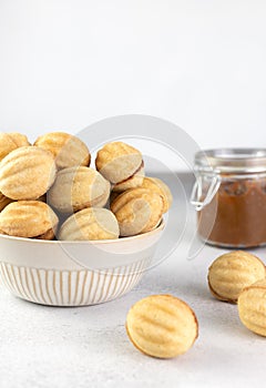 Russian cookies Nuts or Oreshki in shape of a walnut with boiled condensed milk. Russian cuisine, desserts. Copy space.