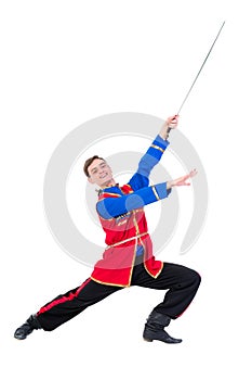 Russian cossack dance. Young dancer posing with sword