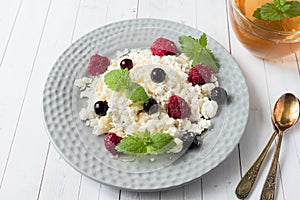 Russian cottage cheese with berries, honey mint, selective focus, healthy Breakfast