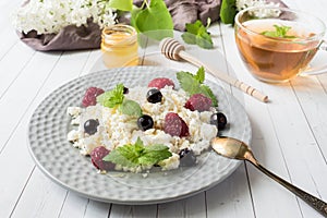 Russian cottage cheese with berries, honey mint, selective focus, healthy Breakfast