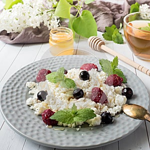 Russian cottage cheese with berries, honey mint, selective focus, healthy Breakfast