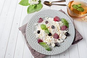 Russian cottage cheese with berries, honey mint, selective focus, healthy Breakfast