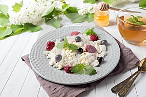 Russian cottage cheese with berries, honey mint, selective focus, healthy Breakfast