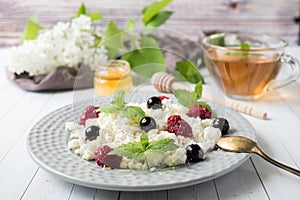 Russian cottage cheese with berries, honey mint, selective focus, healthy Breakfast