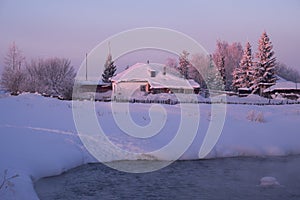Russian country house izba in Altai village Semiletka on the ban photo