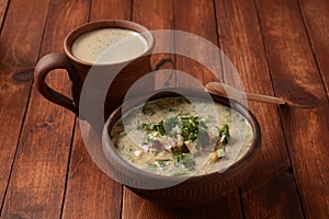 Russian cuisine- Okroshka, Summer light cold yogurt soup with cucumber, radish, eggs and dill with sour cream