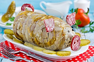 Russian dish holodets, headcheese, pork meat jelly, aspic in bottle shaped funny pig photo