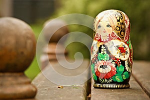 Russian doll isolated on bench