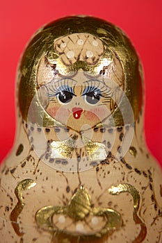 RUSSIAN DOLL ON RED BACKGROUND