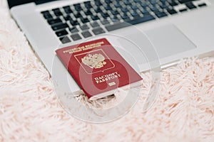 Russian Federation foreign passport on laptop keyboard. Prohibition of access to the Internet without passport data