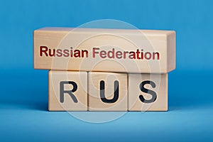 Russian Federation and RUS symbol. Concept words Russian Federation and RUS on wooden blocks.