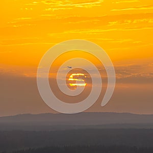 Russian fighter Su-27 in the sunset sky