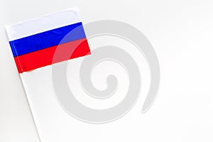 Russian flag concept. Small flag on white background top view copy space