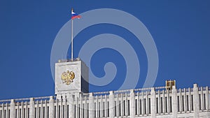 Russian flag and state emblem on the top of the government house in Moscow, 4K