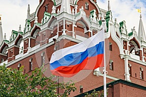 Russian flag waving on background of Kremlin tower