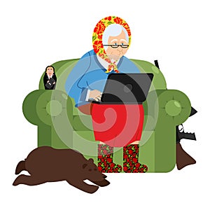 Russian hacker Grandmother and laptop. old woman in an armchair