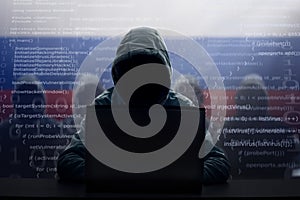 Russian hacker at laptop. Malware and virus photo