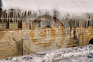 Russian hut with icicles on the roof