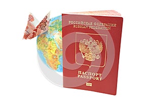 Russian International passport, globe and origami plane made fro