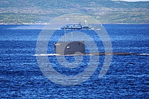 A Russian Kilo Class diesel-electric submarine is diving in Kola Bay, Russia.