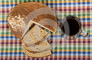 Russian kvas in mug and slices of bread, top view